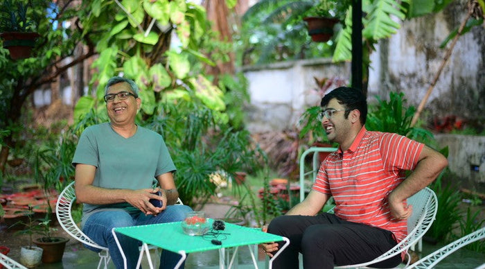 A member of the JhaJi Store team collecting customer feedback.